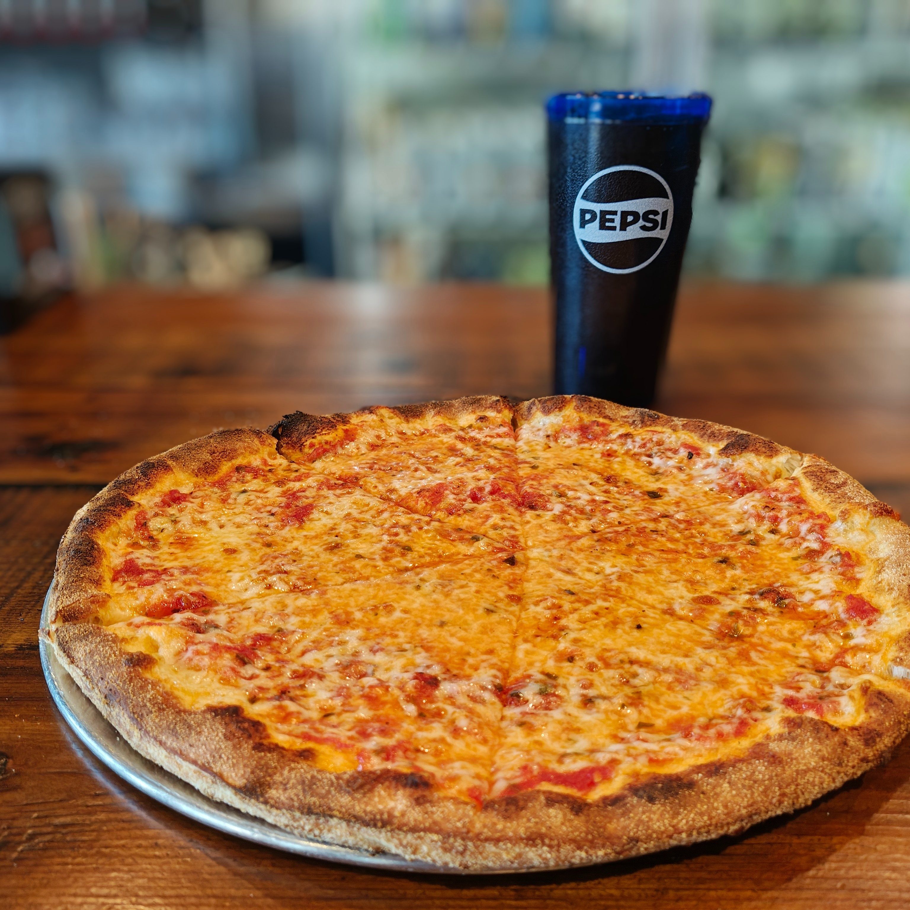 The New Yorker Pizza (Traditional Cheese Pizza).